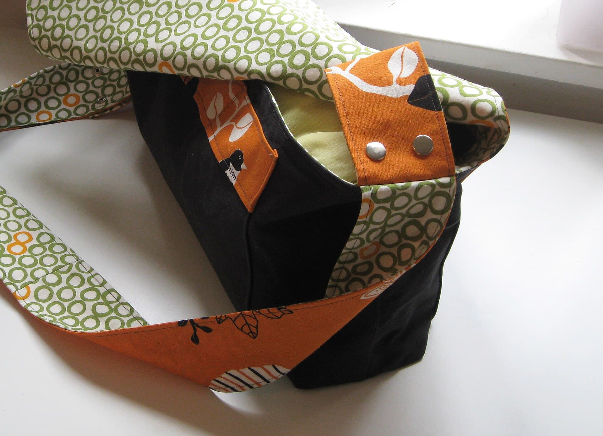 The inside of a diaper bag packed with bottles, wipes and baby kit