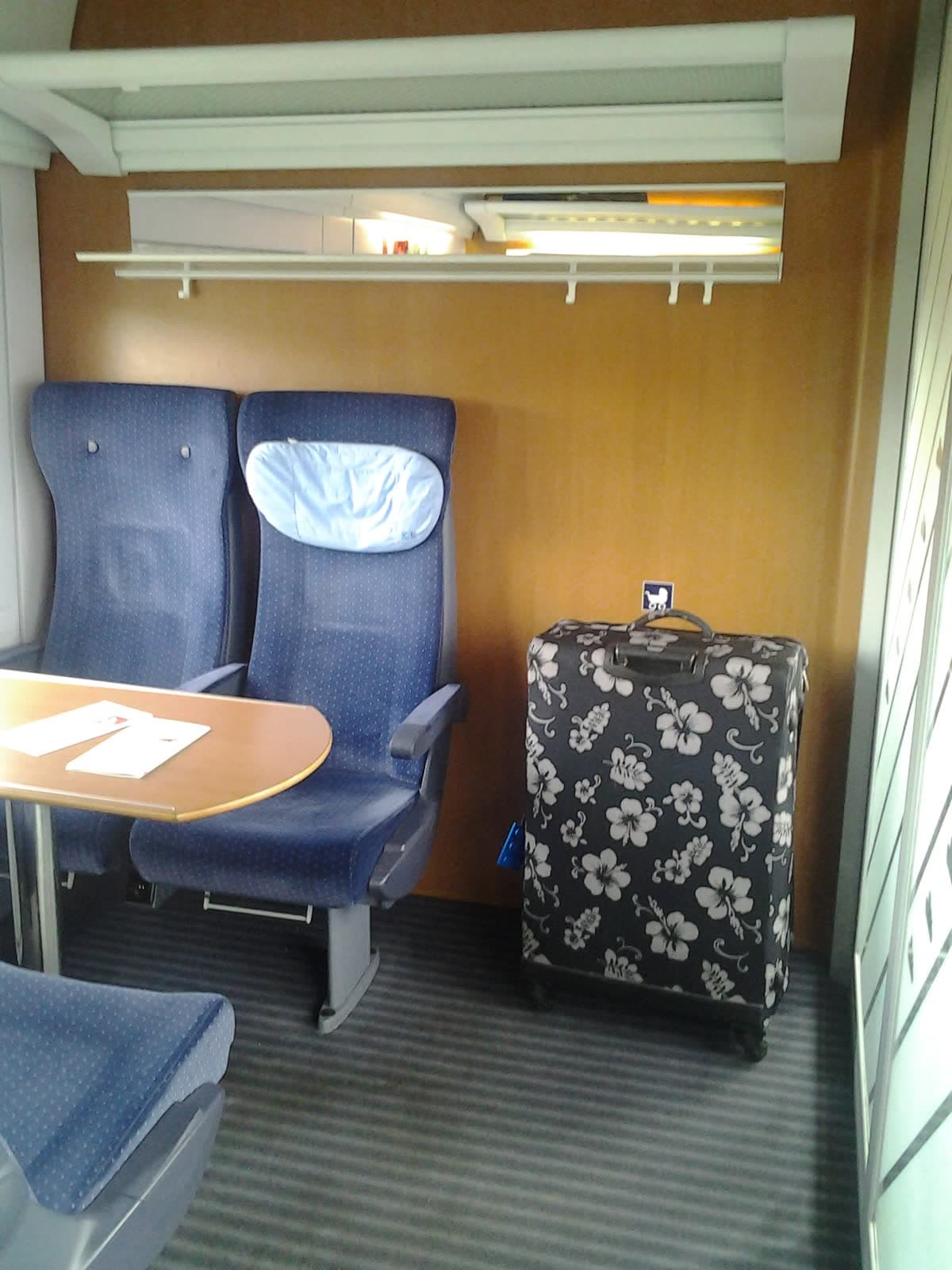 A toddler compartment on a German ICE train, with tables, seats and extra luggage space